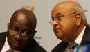 South Africa’s former Finance Minister Nhlanhla Nene has a word with the reappointed Finance Minister Pravin Gordhan. Gordhan will come back in the position he had previously held for five years.